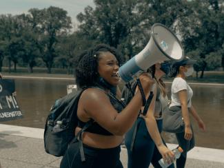 Woman speaking with bullhorn