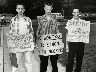 Boys wearing anti-school integration signs