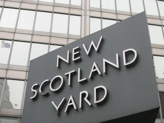 sign that says new scotland yard