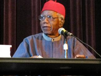 Chinua Achebe speaking at podium