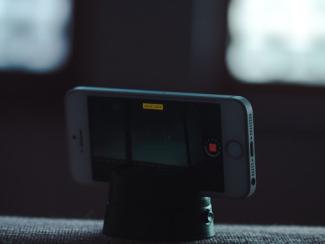 cell phone sitting on a tripod