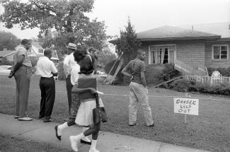 Birmingham residents view the bomb-damaged home of NAACP attorney Arthur Shores on September 5, 1963