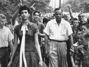 dorothy counts walking in front of a crowd