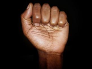 clenched black fist raised 