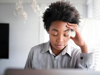 black woman looking stressed 