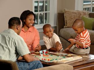 black family playing a board game 