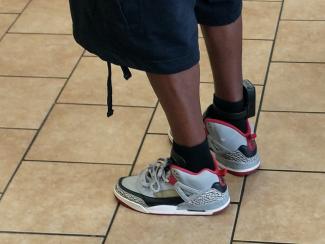 A person wearing an ankle monitor 