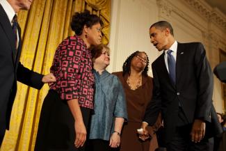 President Barack Obama greets Louvon Harris, left, Betty Byrd Boatner, right, both sisters of James Byrd, Jr., and Judy Shepard, center, mother of Matthew Shepard