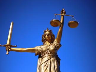 lady justice holding a sword and the scale of justice 