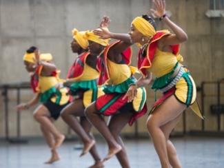 black women in a line dancing