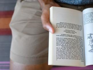 person reading open book on lap