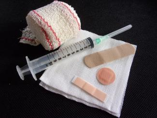 syringe for vaccine and bandaids