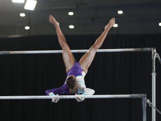 Gymnast on uneven bars