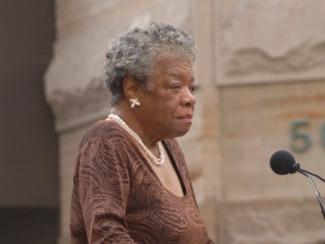maya angelou in front of a microphone