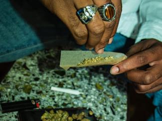 Hands grinding marijuana