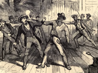 men fighting in a barn