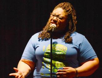 Andrea Sanderson recites a poem she wrote during the 4th Annual Teen Dating Violence Awareness Poetry Slam