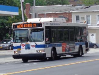 bus driving down a street 