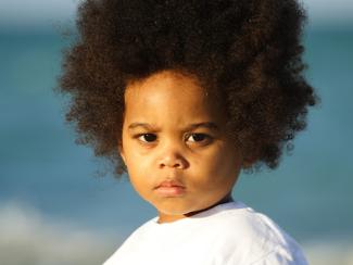 small child looking directly into the camera