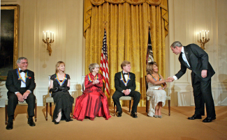 President Bush congratulates Tina Turner at the Kennedy Center Honors