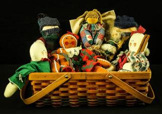 handmade dolls in basket