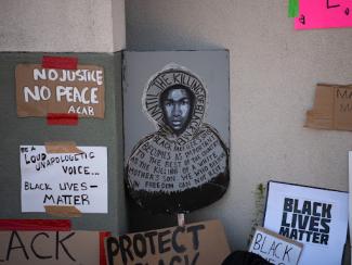 poster of trayvon martin in a black lives matter protest 