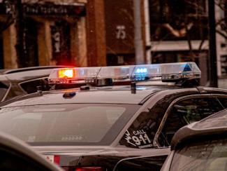 top of the police car  sirens on lit up