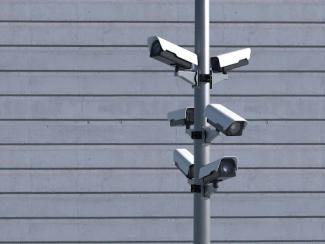 cameras on a pole watching