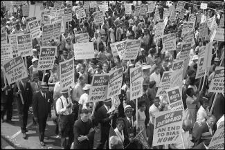 protestors holding signs during the march on washington