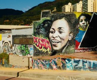 assata's face graffiti on a wall