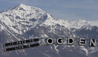 sign that says it pays to live in ogden