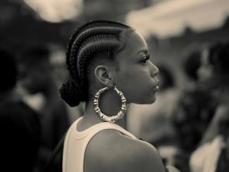 black woman wearing braids in a bun