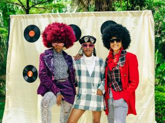 a group of people three people standing next to each other