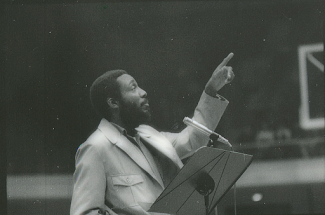 man pointing out to the audience