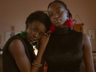 a couple of women standing next to each other