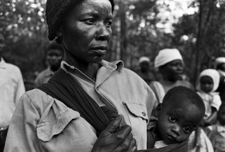 black woman holding a baby