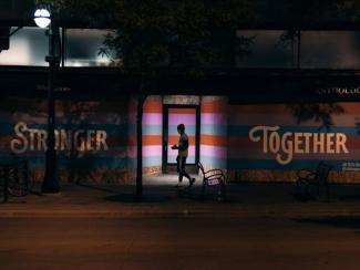 man in black jacket walking on street