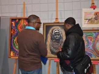 two black people observing art