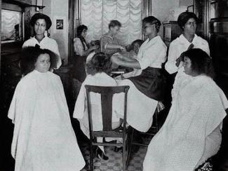 black women being attended to by black beauticians
