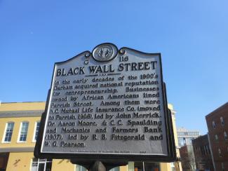 historical sign sharing details about black wall street in durham