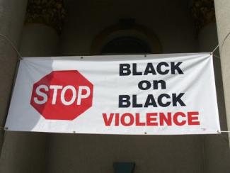 banner that says black on black violence