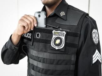 law enforcement officer with badge on chest