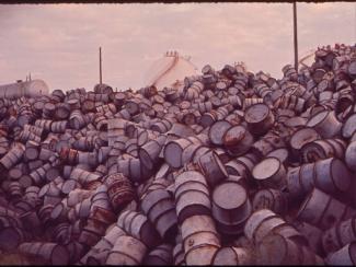 mountain of damaged oil drums
