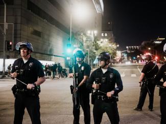 group of police standing together in the street