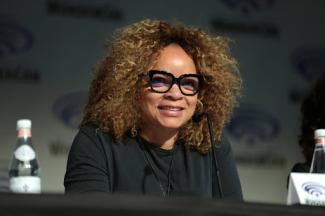 ruth carter smiling sitting down