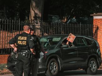main in black and white crew t shirt and black pants 