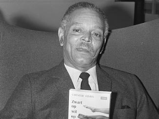 picture of chester himes holding a book 