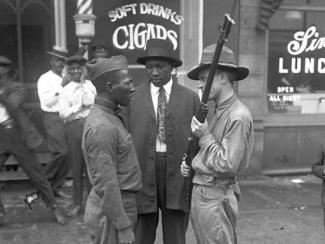 three black men standing together