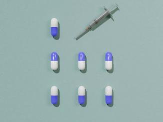 a group of blue and white pills next to a syquet