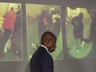 man in front of a projection